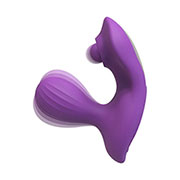 Vibracijski analni stimulator s stimulatorjem presredka